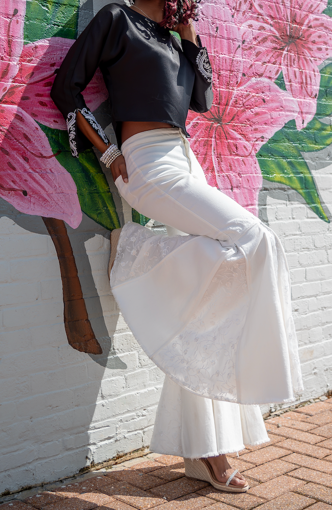 White flared jeans with a black top