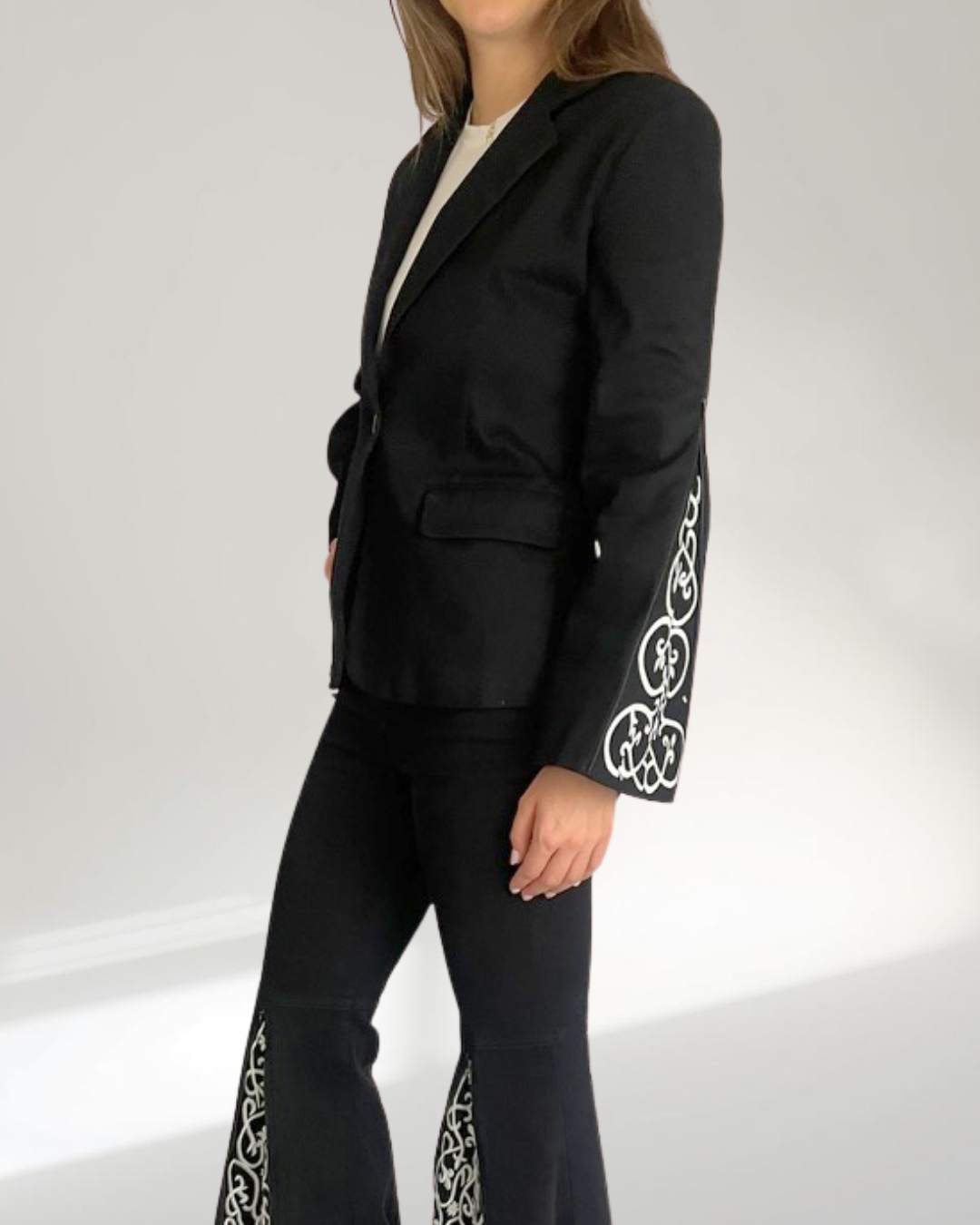 model angled shot with the blazer sleeves half open