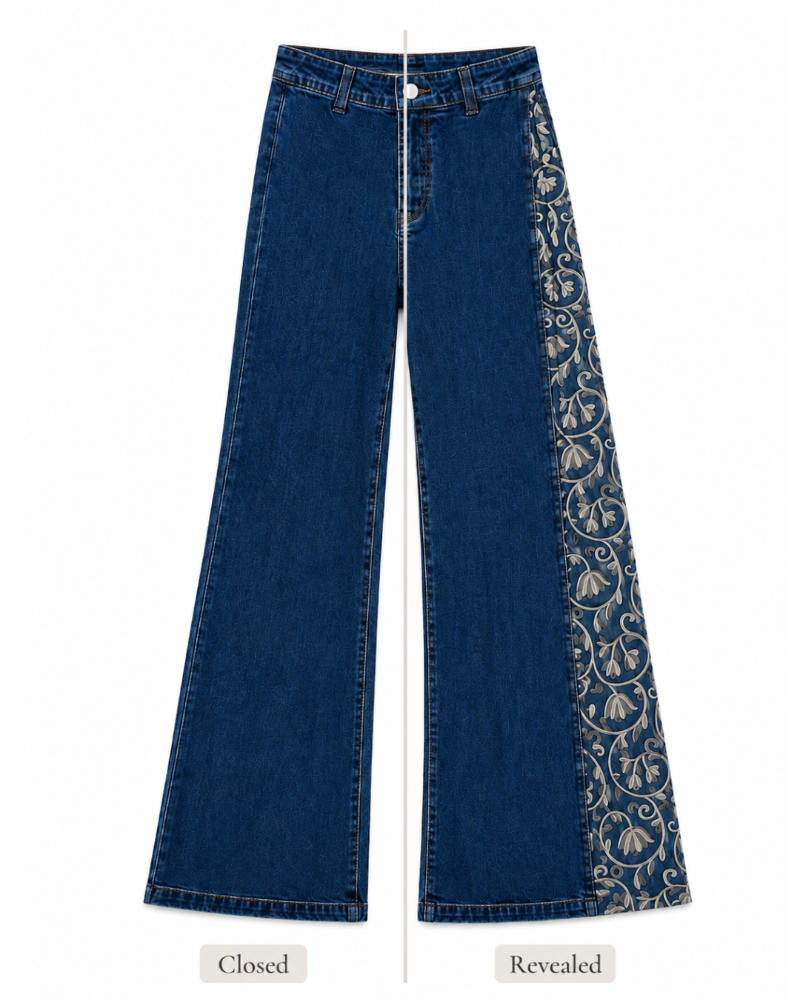Blue wide-leg denim jeans shown front-facing on a white background, with a vertical split indicating the 'Closed' and 'Revealed' views. The left side is plain blue denim, while the right side features a decorative panel with beige floral scroll embroidery.