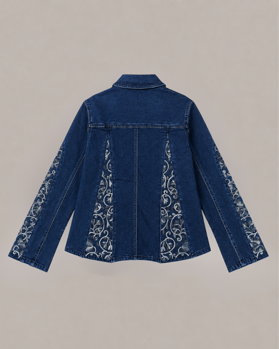 Back view of DuoCut transformable denim jacket with concealed panels opened to reveal Heirloom Bloom floral embroidery.