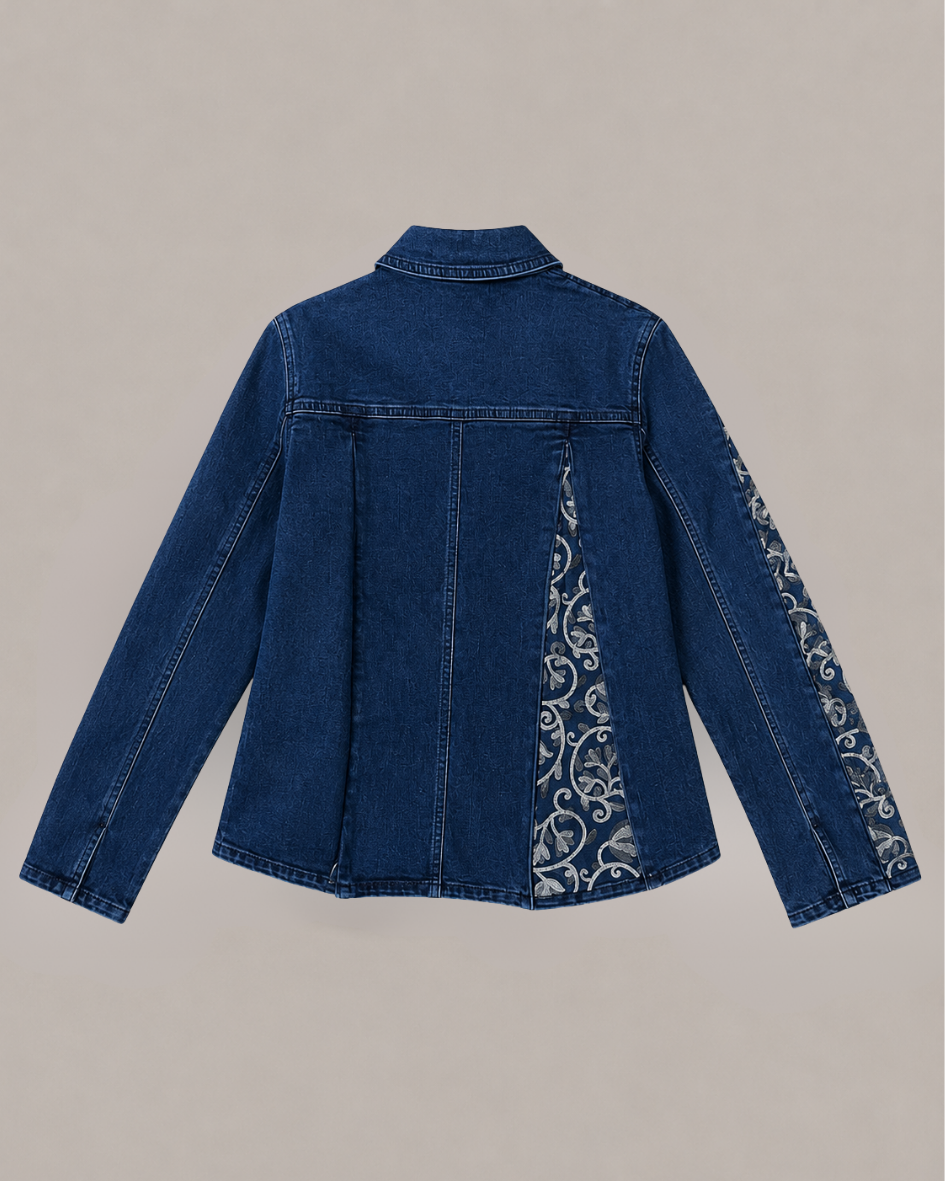 Concealed modular zipper construction in the back of the DuoCut transformable denim jacket showing transformation with one panel closed for a sleek look, and one revealed to show embroidery. 