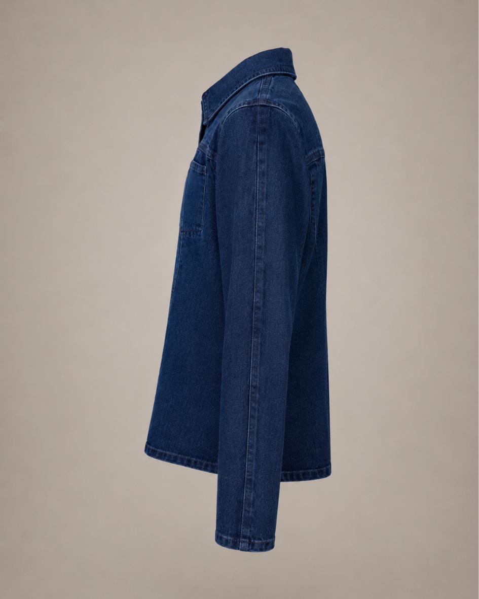 DuoCut dark denim jacket side view with concealed embroidery panels fully zipped closed for a fitted polished silhouette.