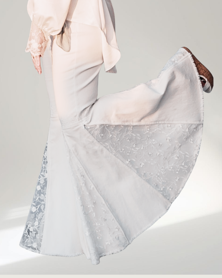 Model wearing the everafter jeans close up shot one leg up